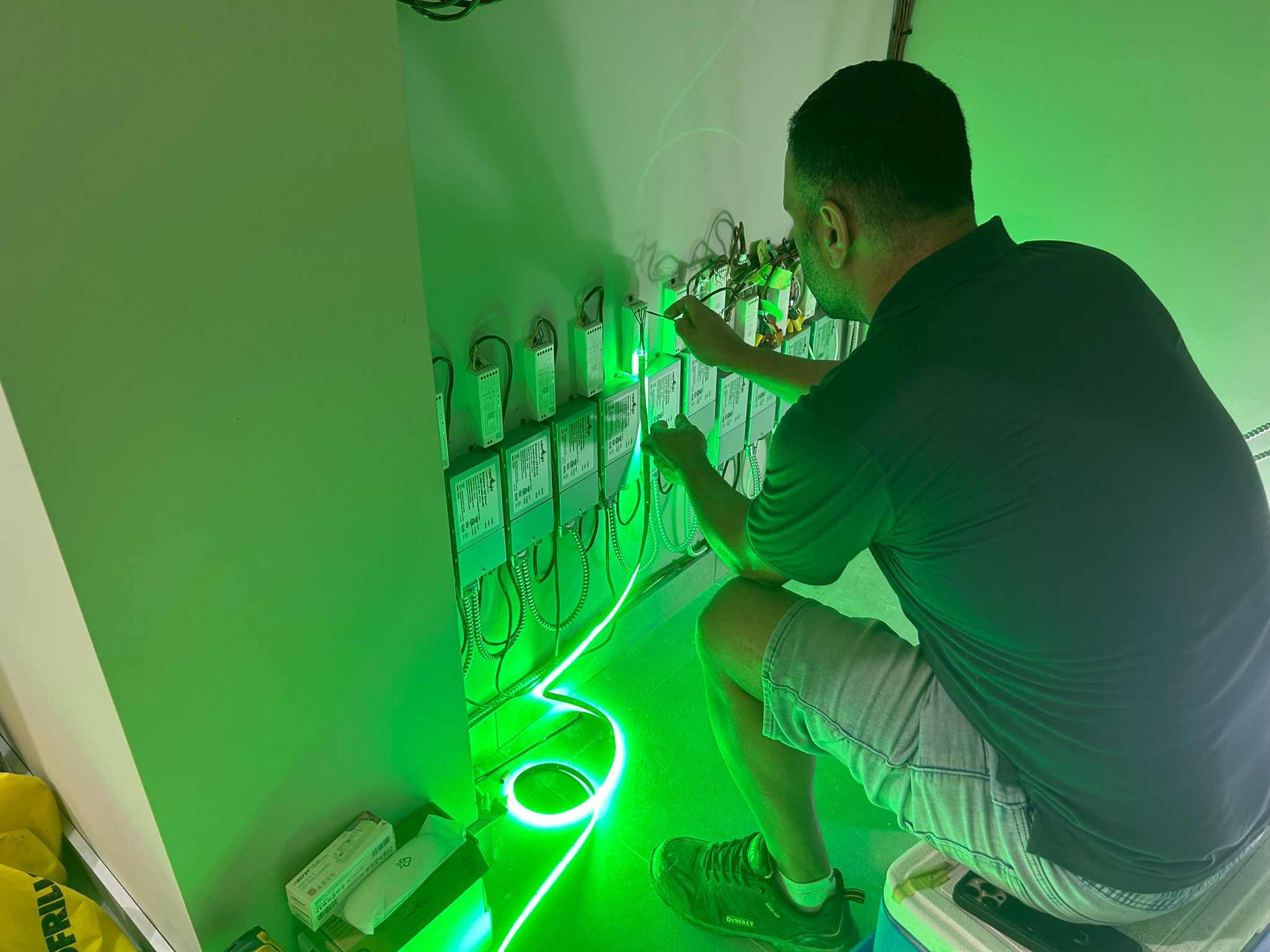 Electrician labelling breaker circuits on a 600A distribution board